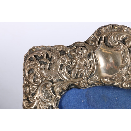 67P - Group of four hallmarked silver picture frames, and one white metal with elaborate rococo frame, 22c... 