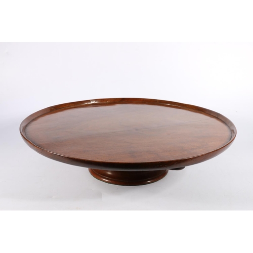 695 - Mahogany Lazy Susan, with dished circular top, raised on possible later base, 50cm diameter.