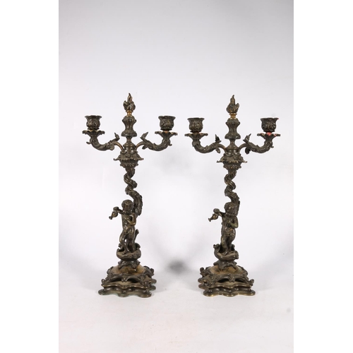 375 - Pair of 19th c. bronze candelabra  with flame finials, flanked by two arm candleholders, on scrollin... 