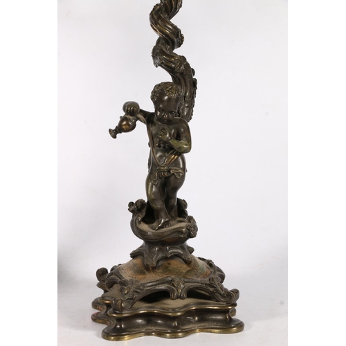 375 - Pair of 19th c. bronze candelabra  with flame finials, flanked by two arm candleholders, on scrollin... 