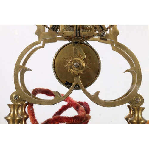 390 - Brass skeleton clock with anchor escapement striking on a bell, under glass dome, 40cm tall.