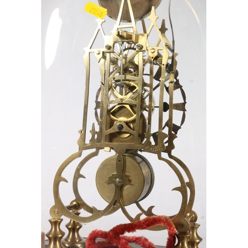 390 - Brass skeleton clock with anchor escapement striking on a bell, under glass dome, 40cm tall.