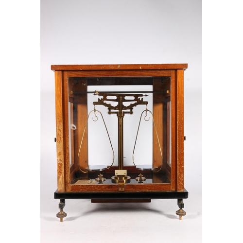 413 - Early 20th c. set of scales in mahogany and glass case, 43 x 36 x 27cm.