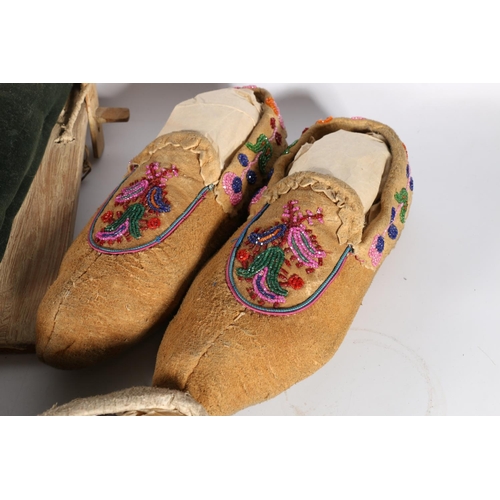 420 - Five pairs of Native American moccasins, money pouch and papoose, along with photograph of John Gard... 