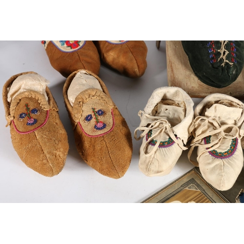 420 - Five pairs of Native American moccasins, money pouch and papoose, along with photograph of John Gard... 