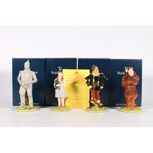 506 - Four Royal Doulton Wizard of Oz figures to include Dorothy, Scarecrow, Tinman, and Lion, with origin... 