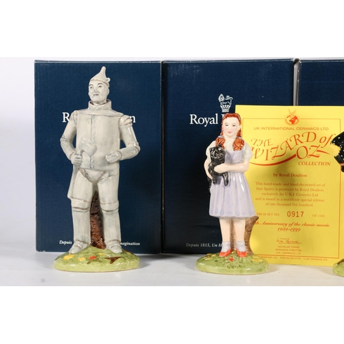 506 - Four Royal Doulton Wizard of Oz figures to include Dorothy, Scarecrow, Tinman, and Lion, with origin... 