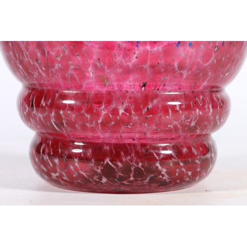 429 - Scottish art glass, a blue and pink mottled thistle form, manner of Monart and Vasart, 20cm tall.