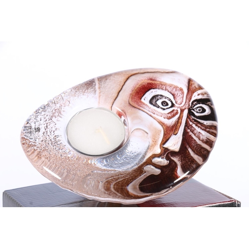 443 - Mats Jonasson of Maleras Sweden, a Swedish art glass face design paperweight candleholder, number 69... 