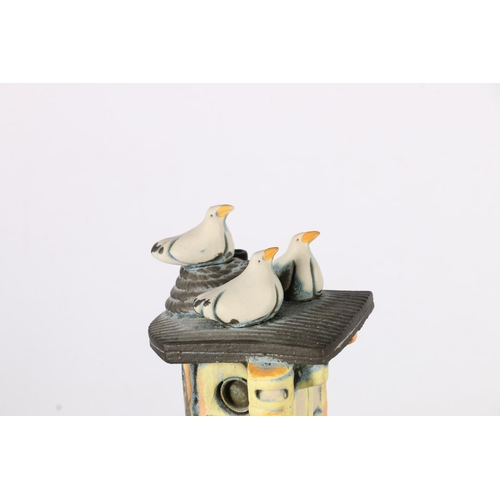 471 - RONNIE FULTON (Scottish b1958), a pottery model of a boat with seagulls raised on wooden stand, 35cm... 