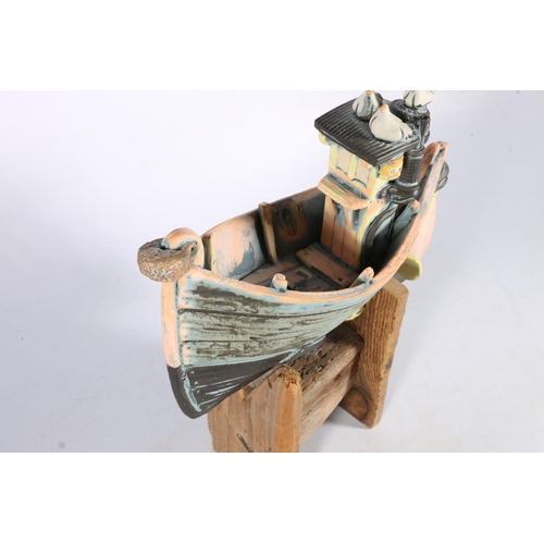 471 - RONNIE FULTON (Scottish b1958), a pottery model of a boat with seagulls raised on wooden stand, 35cm... 