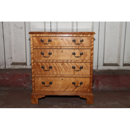 671 - Late 19th century small satinwood chest of drawers, with four graduated drawers, raised on bracket s... 