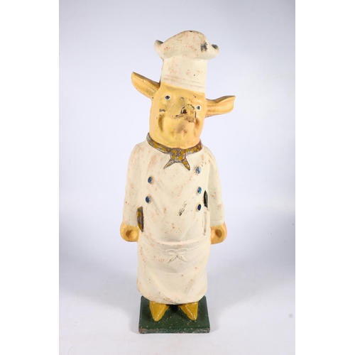 366 - Painted flat back cast iron figure of pig in chefs clothing, 60cm. 