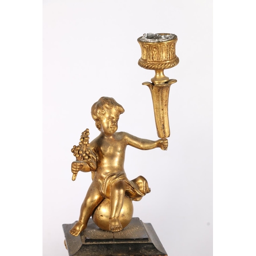 377 - Pair of gilt metal candlesticks in the form of putti, on boulle style bombe bases, 26cm.