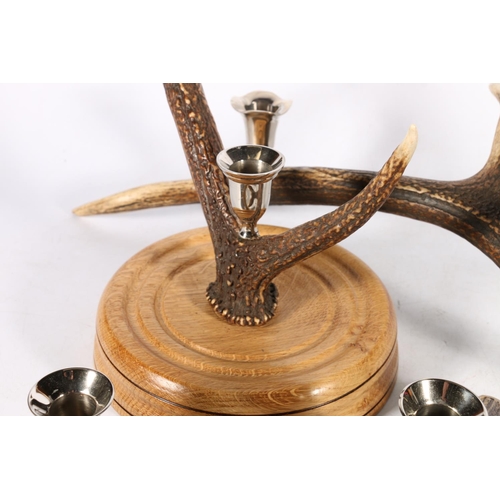 403 - Antlers with polished metal candle holders, to include a candelabra, 51cm, a centrepiece, and four i... 