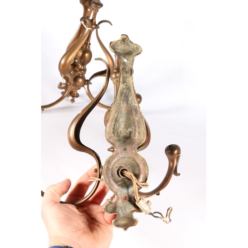 416 - Pair of Art Nouveau copper wall lights, with twin branches, 30cm.