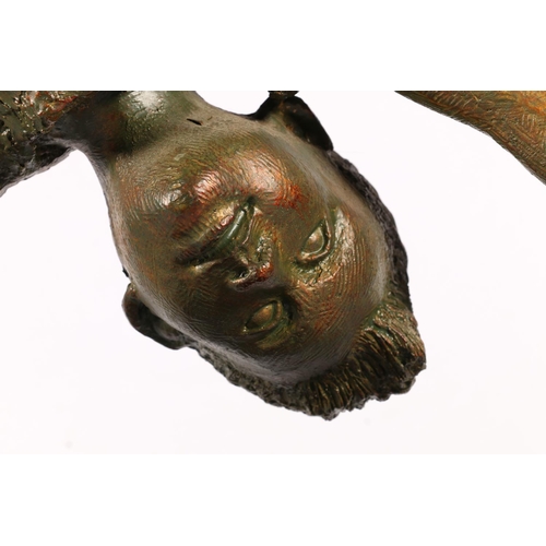 422 - Resin sculpture of child on one hand or performing cartwheel, 84cm