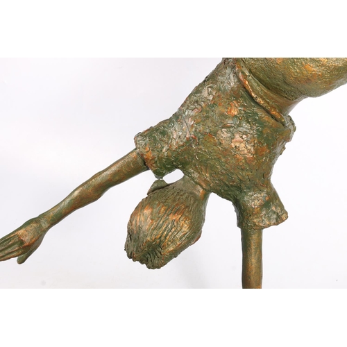 422 - Resin sculpture of child on one hand or performing cartwheel, 84cm