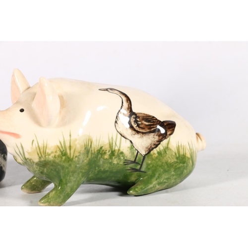 485 - Griselda Hill Wemyss Pottery, a goose pattern model of a pig, signed to the underside, 16cm long, al... 