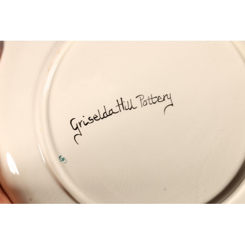 493 - Griselda Hill Wemyss Pottery, a circular plate decorated in the grape and vine pattern, signed to th... 