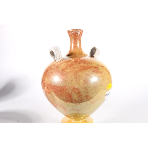 500 - Lustre glazed terracotta amphora style vase with two ring handles raised on circular base, in the ma... 