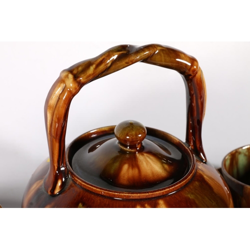 501 - Scottish Pottery to include a Dunmore treacle glazed teapot, 21cm, along with six Dunmore cups with ... 