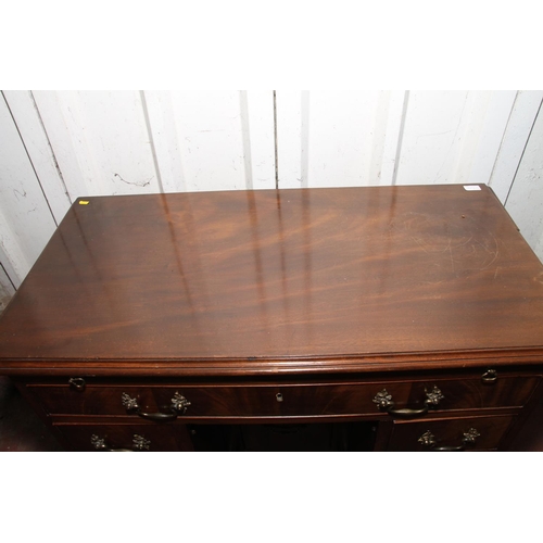 664 - 19th century mahogany dressing table, the top with canted corners over brushing slide, long frieze d... 