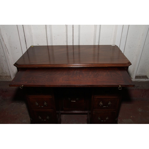 664 - 19th century mahogany dressing table, the top with canted corners over brushing slide, long frieze d... 