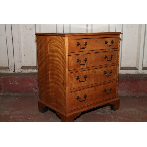 671 - Late 19th century small satinwood chest of drawers, with four graduated drawers, raised on bracket s... 