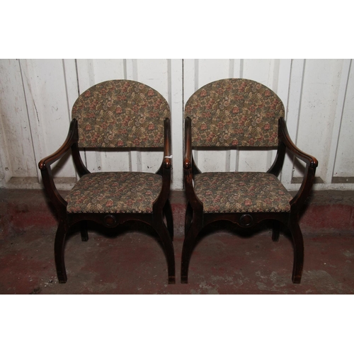 672 - Pair of late 19th/early 20th century x-framed armchairs, with later floral upholstery to backs and s... 