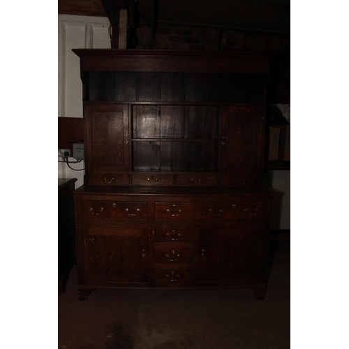 680 - Georgian oak dresser, the moulded cornice over plate rail, with shelves and cupboards, on base with ... 