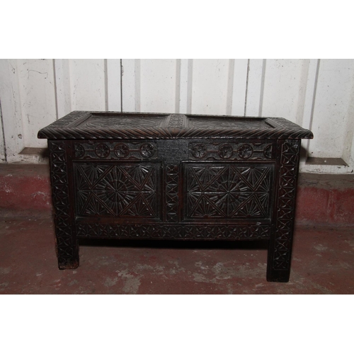 683 - 17th/18th century coffer, with intricately foliate carved top, front and sides, 57 x 94 x 50cm.