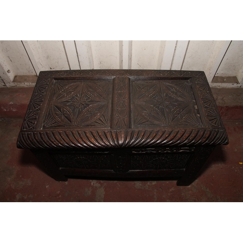 683 - 17th/18th century coffer, with intricately foliate carved top, front and sides, 57 x 94 x 50cm.