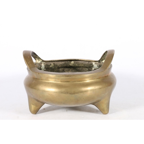 525 - Chinese bronze censor with raised pierced handles on feet, seal mark impressed to base, 12cm high.