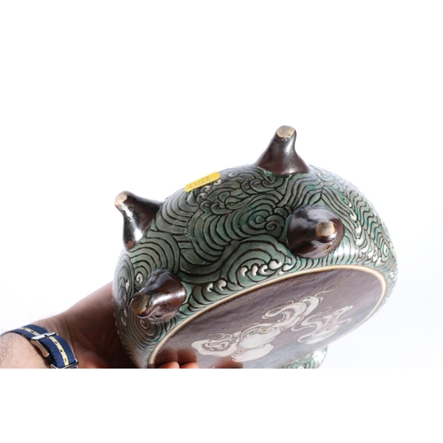 552 - Japanese pottery moon flask decorated on one side with an octopus tightening bandana and two octopus... 