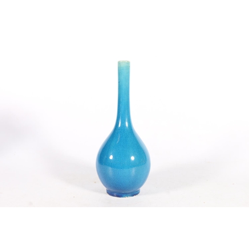 560 - Chinese blue pottery slim neck bottle vase, 22cm tall.