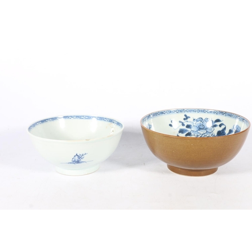 570 - Two Chinese bowls, both with Christies Nanking Cargo lot labels, larger with brown glaze to exterior... 