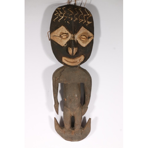 579 - African carved wooden figure of man, 62cm.