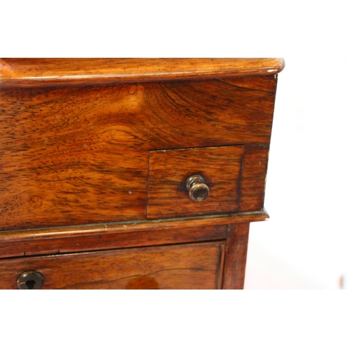 709 - 19th century mahogany Davenport, with satinwood interior, raised on barley twist supports and bun fe... 