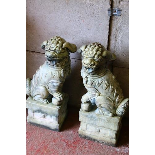 710 - Pair of composition Guardian Lions, with applied verdigris finish, each 80cm high.