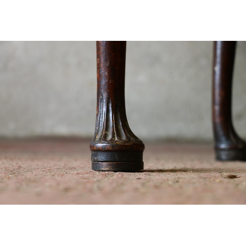 735 - Late 18th/early 19th century oak lowboy, with carved front, raised on cabriole supports terminating ... 