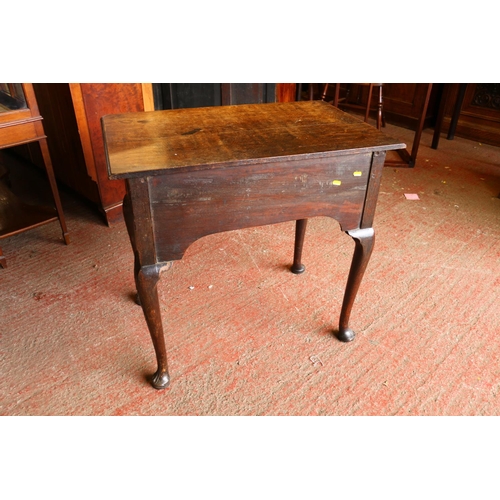 735 - Late 18th/early 19th century oak lowboy, with carved front, raised on cabriole supports terminating ... 