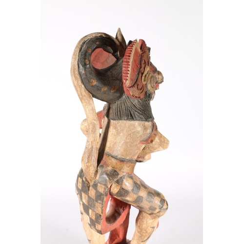 576 - Two South East Asian painted wooden figures of deities, 56cm.