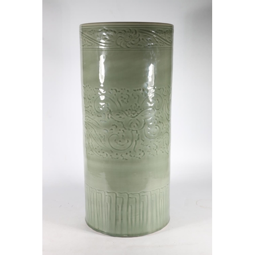 582 - Celadon green umbrella stand with foliate design, 60 x 28cm.