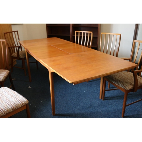 640 - McIntosh of Kirkcaldy teak dining table with six (four plus two) chairs, table measures 73 x 235 x92... 