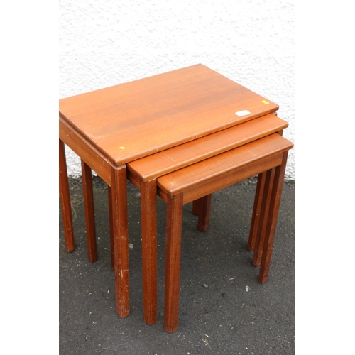 606 - Mid 20th-century teak nest of three tables by A H McIntosh & Co. Ltd of Kirkcaldy, the rectangul... 