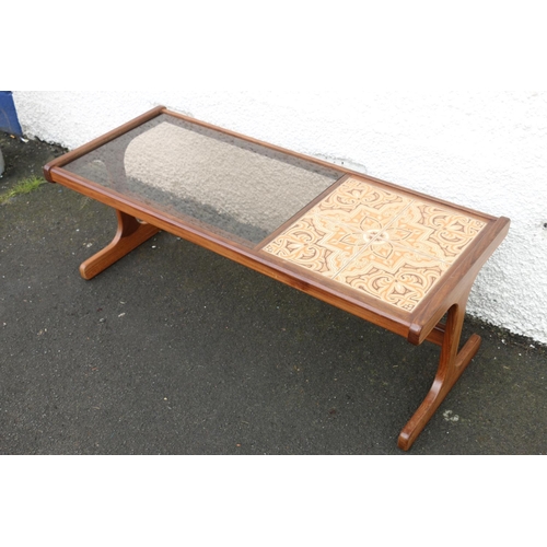 615 - Mid-20th century design coffee table by G-Plan, the partially tiled top partnered with smoked glass ... 