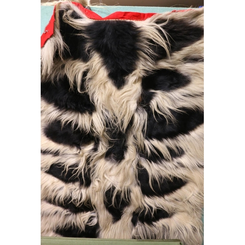 409 - Vintage colobus monkey rug wall hanging, 120 x 93 cm, and fly whisk.