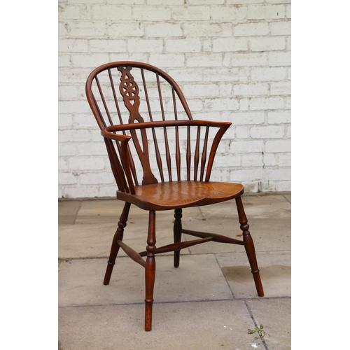 731 - 19th century wheelback Windsor chair, with elm seats, raised on turned supports, united by H-stretch... 