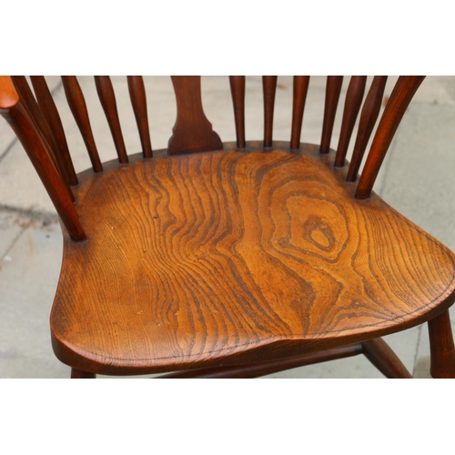 731 - 19th century wheelback Windsor chair, with elm seats, raised on turned supports, united by H-stretch... 